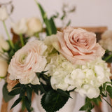 Romantic, garden-inspired florals in a ceramic vessel.